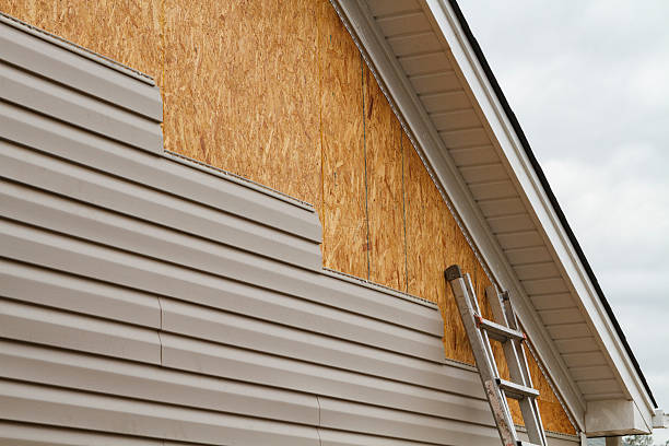 Professional Siding Installation technician working in West College Corner, IN